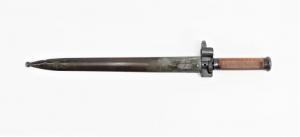 Circa 1935 Hungarian Model 1935 cavalry bayonet and scabbard, overall 18 ¾ inches (the blade 13 ¼ inches long), with a wooden grip, quadrangular blued blade and scabbard (est. $200-$300).