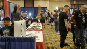 Attendees Visit Exhibitors and Vendors at Tattoo Expo