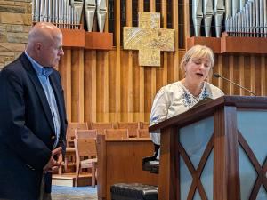 St. Martin's Pastor Dave Oravec receives a certificate of recognition from The City of Annapolis' Chief of Staff Cate Pettit at the ICONS in Transformation Opening Reception on Thursday, April 20 in Annapolis, Md.