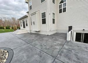 Tuscan slate stained concrete patio installed by LNS Concrete