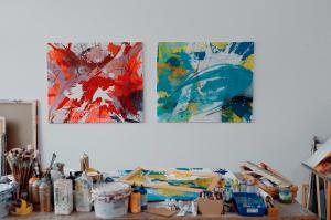 Abstract expressionist style paintings of contemporary informal artist Anja Stemmer in her studio. Colorful abstract painting XXL art on canvas for home and office