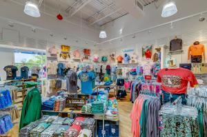 Interior of a Palmetto Moon Store with displays and racks of clothing and accessories