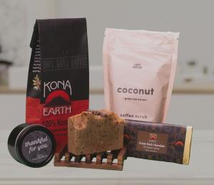 Ultimate Spa Day gift set with exfoliating scrub, soap, candle, chocolate bar and bag of coffee.