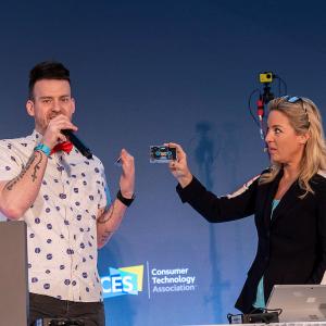 Mixxtape on stage at CES with Paul Burns being interviewed by Jennifer Jolly