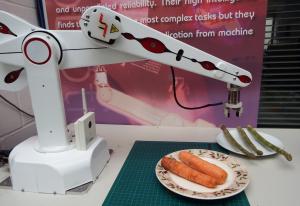 R12 robot trying to pick up asparagus out of reach.