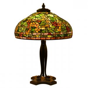 Tiffany Studios (N.Y.) table lamp with telescoping base and a beautiful 32-inch Nasturtium shade having numerous yellow and orange blossoms with green slag foliage background ($71,500).