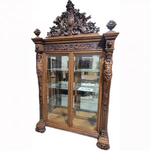 R. J. Horner china cabinet in the Atlas pattern, 95 inches tall, made from quarter sawn oak, with elaborate scroll work, three glass shelves, Neptune, Pegasus and lion heads ($22,000).