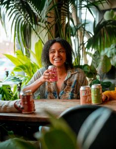 A women drinking a can of wild pop soda