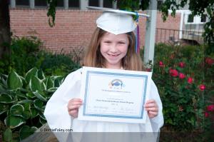 Organizing Photos for Parents of Teens- Little Girl Holding Diploma