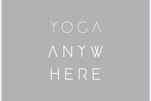Yoga Anywhere Logo white typography on dark grey background