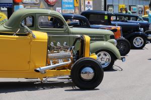 Rows of classic hot rods and vintage cars