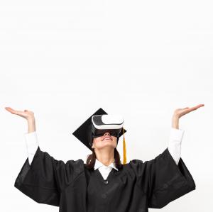 Woman with graduation cap and VR headset with arms raised