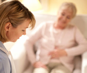 Nurse helping elderly lady