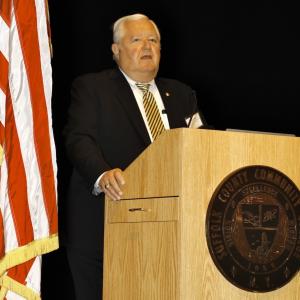 Walter A. Poggi, President, Retlif Testing Labs, LI Council of the Navy League of the USA, Corporate Committee Chairman speaking at podium
