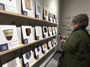 San Francisco State University School of Design Director Mari Hulick accesses material data through a QR code at the new SFSU Sustainable Materials Learning Library