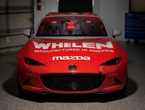 front view of Red and White MX-5 Cup Car with Whelen Manufactured in America and mazda logos