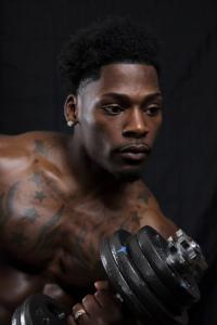 Pro Bodybuilder Antonio Diaz lifting weights