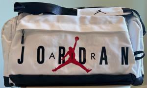 This white Jordan duffle bag, with the Jumpman logo, contains cancer-causing PFAS chemicals, according to a lawsuit.