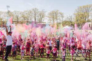 Crowd celebrating with Holi Colors in the air