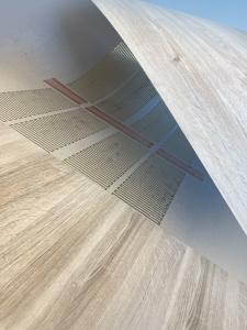 The photo shows the thin digital heating solution inside laminate.
