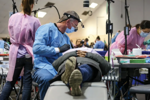 Dentist helping patients pro bono