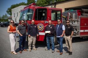 Members of Langan Financial Group, Hayman Studio, and Gig and Take present $5100 to the Fire Chiefs and Firefighters Association of York County.