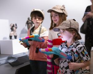 Children at the Denver Art Museum use tablets to explore ARtVenture, a new augmented reality experience made using ARtGlass software.