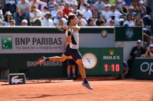 ROLEX TESTIMONEE CARLOS ALCARAZ PLAYS A BACKHAND AT ROLAND-GARROS 2022
