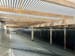 The inside of the Alameda Reservoir before the roof replacement project begins. Photo showcases the support beams and interior roof.