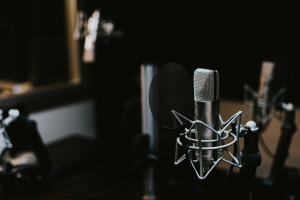A podcaster’s microphone sits in a studio, similar to what Darren and Mike used to interview