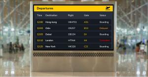 A flight information display system shows flight arrival and departure details