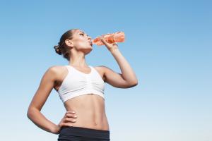 Woman drinking a functional drink with minerals