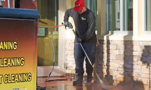 Commercial pressure cleaning service in action, removing dirt and grime from surfaces.