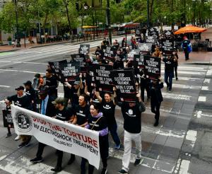 Hundreds march to demand the APA cease advocating the use of electroshock.