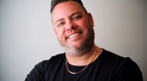 Forrest Blackburn, Director of Operations for Green Elephant Development Poses In A Black Shirt For Photoshoot