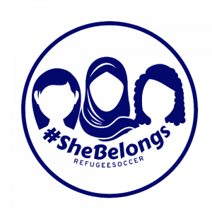 #SheBelongs Logo Blue with Shadow Faces of Three Refugee Girls