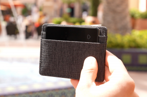 Ace Card inside a small grey single wallet, track all your belongings.