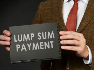 A man in a suit holds an inscription Lump sum payment