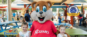 Kozomo the Knoebels mascot taking photo with two young girls
