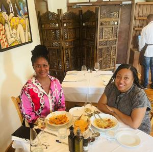 AfriCentric founder Itumeleng Pooe joins influencer Demetria Lucas for dinner in South Africa.