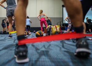 A group of people working out at a fitness conference - IDEA World