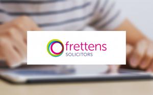 Frettens Solicitors logo with a close-up of someone using a tablet