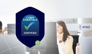 Cyber Essentials certification logo and a woman at the computer in the IPXO office