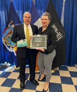 Tom Burke and Jen Miret accepting NYC Accelerator Innovator Award for INOVUES