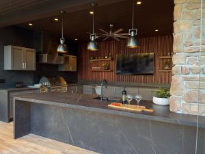 glass doors leading to the fully equipped kitchen and dining area