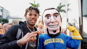 Spero the Hero poses with an FAU Men's Basketball Player before they head off to the Final Four tournament