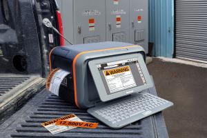 Toro Max label printer prints compliant safety labels while in use on the tailgate of a work truck