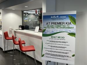 Premier Kia shares it's recycling strategies with all visitors with signs and table tents.