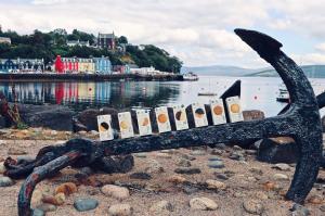 Biscuit boxes displayed on an anchor in a fishing village