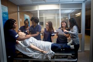 Mercy University Nursing students practice their skills with a simulation manikin at the school's simulation lab.